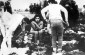 Mia Epstein. She is eighteen. She is squatting down and covering her breasts not just out of modesty but because it is so cold. The people either side of her are her mother and her fifteen year old brother. ©Bunderarchiv/ Yad Vashem Photo Archives