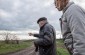 Mykola Kh., born in 1929, pointing out the location of Borivtsi village, from where the Jews were taken to the execution site.  ©Les Kasyanov/Yahad - In Unum.