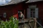 Maria L. in front of her house. ©Sabine Mirlesse/Yahad - In Unum