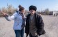 Yahad’s translator with a witness near the former stables. © Les Kasyanov/Yahad-In Unum.