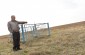 Mikhail, a historian and archaeologist from the village, indicated the location of the mass grave, which is located farther to the right of the memorial. © Cristian Monterroso /Yahad-In Unum