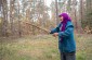 Onysia R., born in 1929, near the mass grave that she saw while grazing her cows nearby. © Les Kasyanov/Yahad-In Unum