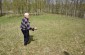 Bronislovas L., born in 1930, pointing out the mass grave of 5 Jewish men from Turmantas, murdered in Čepukìškė by a white armbander. ©Cristian Monterroso/Yahad - In Unum
