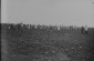 Field workers pose hoeing a field at the Dobrushino collective farm. (Background) two men on horseback.1931 © From the Archives of the YIVO Institute for Jewish Research