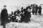 Members of a Latvian self-defence unit assemble a group of Jewish women for execution on a beach near Liepaja. ©Bunderarchiv, Bild_183-B11441