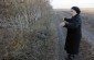 Nelia S., born in 1937, showing the Yahad team the killing site of Jews on the outskirts of the village of Stavky. ©Markel Redondo/Yahad – In Unum